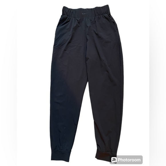 Nike Pants - Womens black nike joggers. Elastic waist. Bottom right leg has spots. See photo